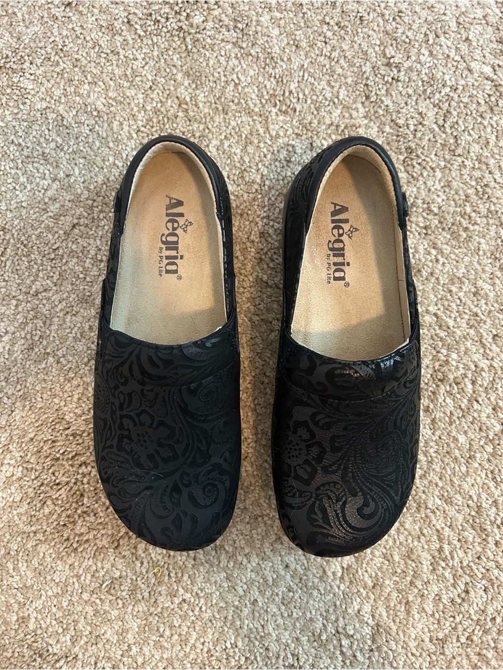 Alegria Black Floral-Embossed Slip-On Moccasins
